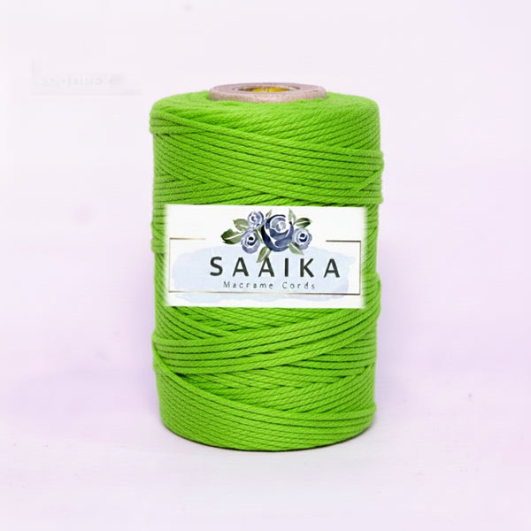Green spool of macrame cord with Saaika label on a white background